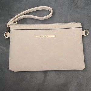 Beige clutch with gold accents in new condition